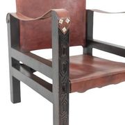 “Safari” armchair in wood and cognac leather. 1960s/70s.