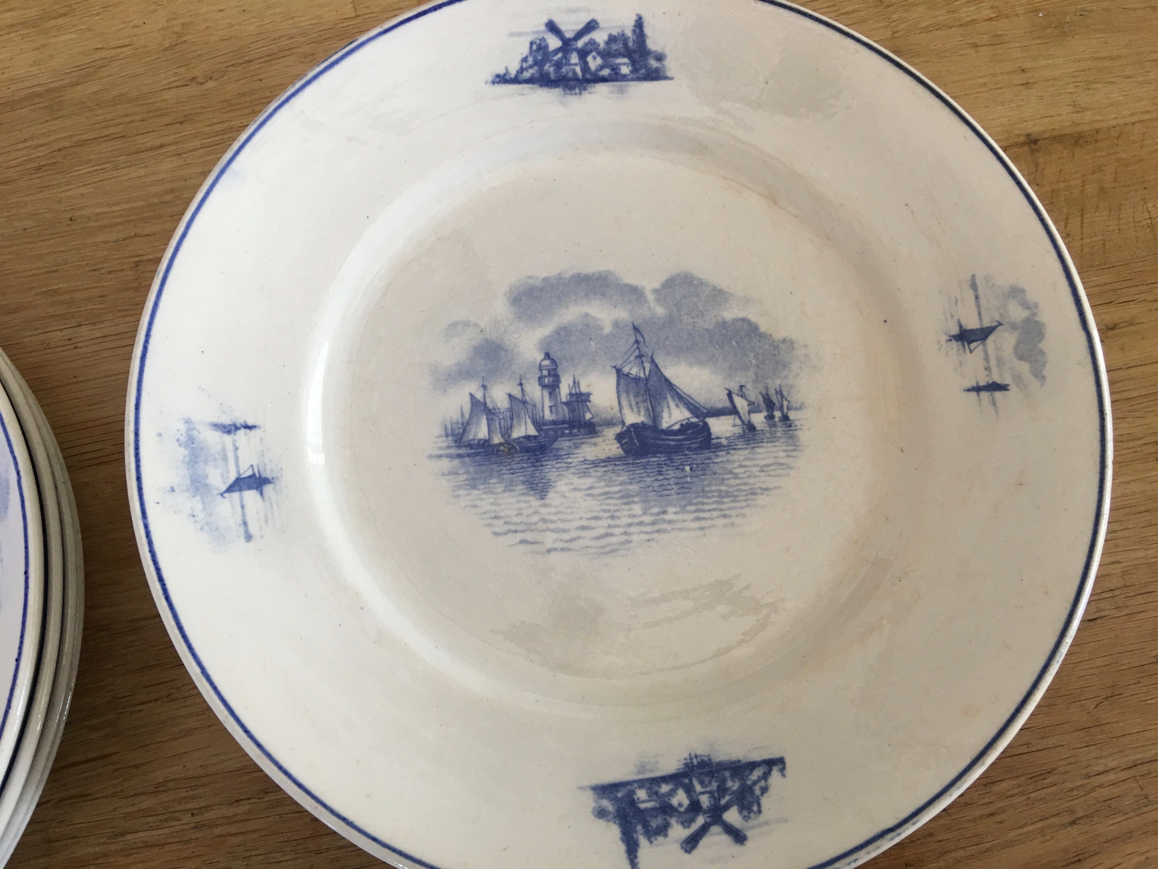 Series of 11 flat plates, Dutch earthenware, early XX