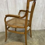 Curved wood and cane armchair