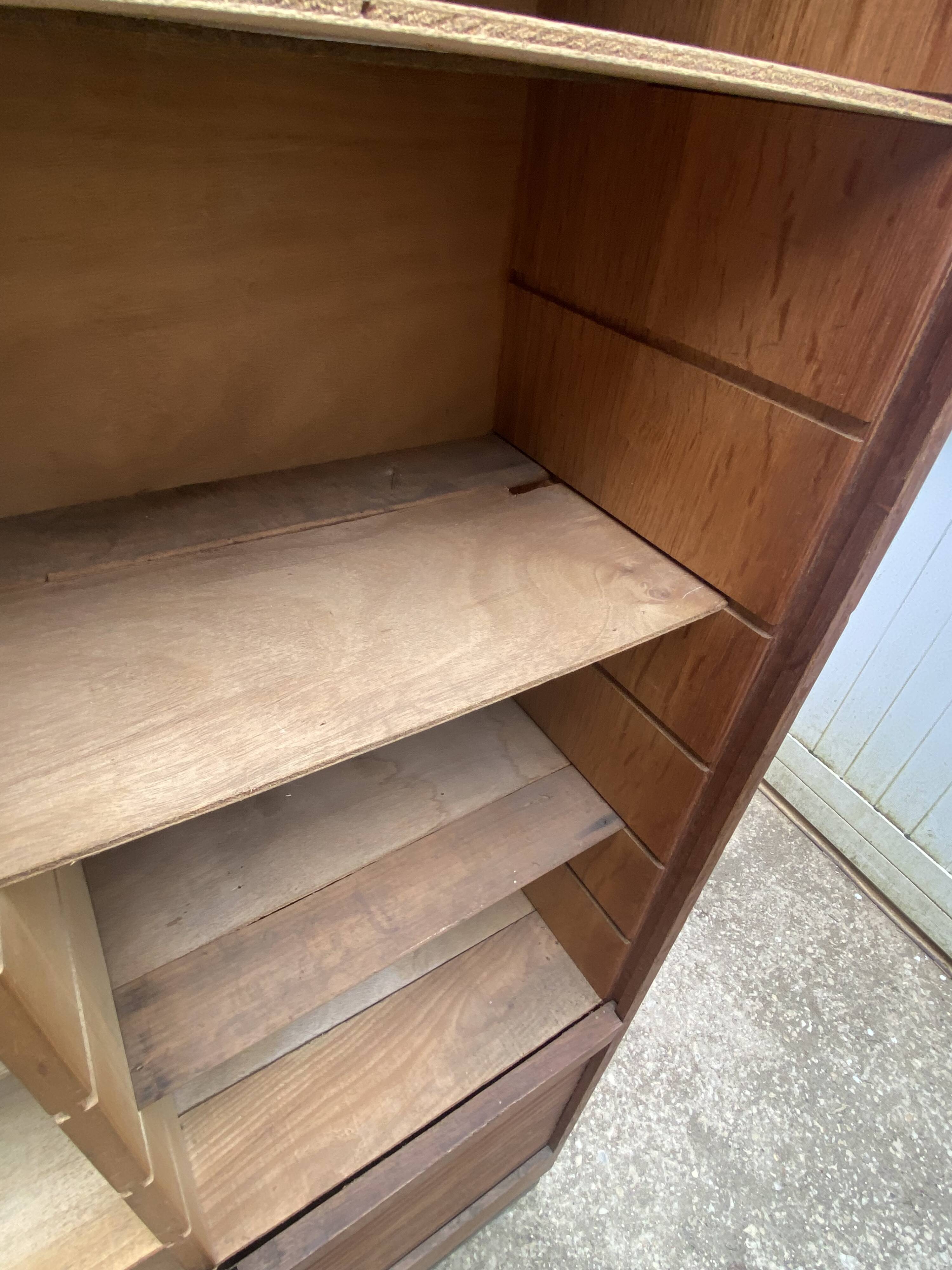 Oak two-column filing cabinet with curtains.