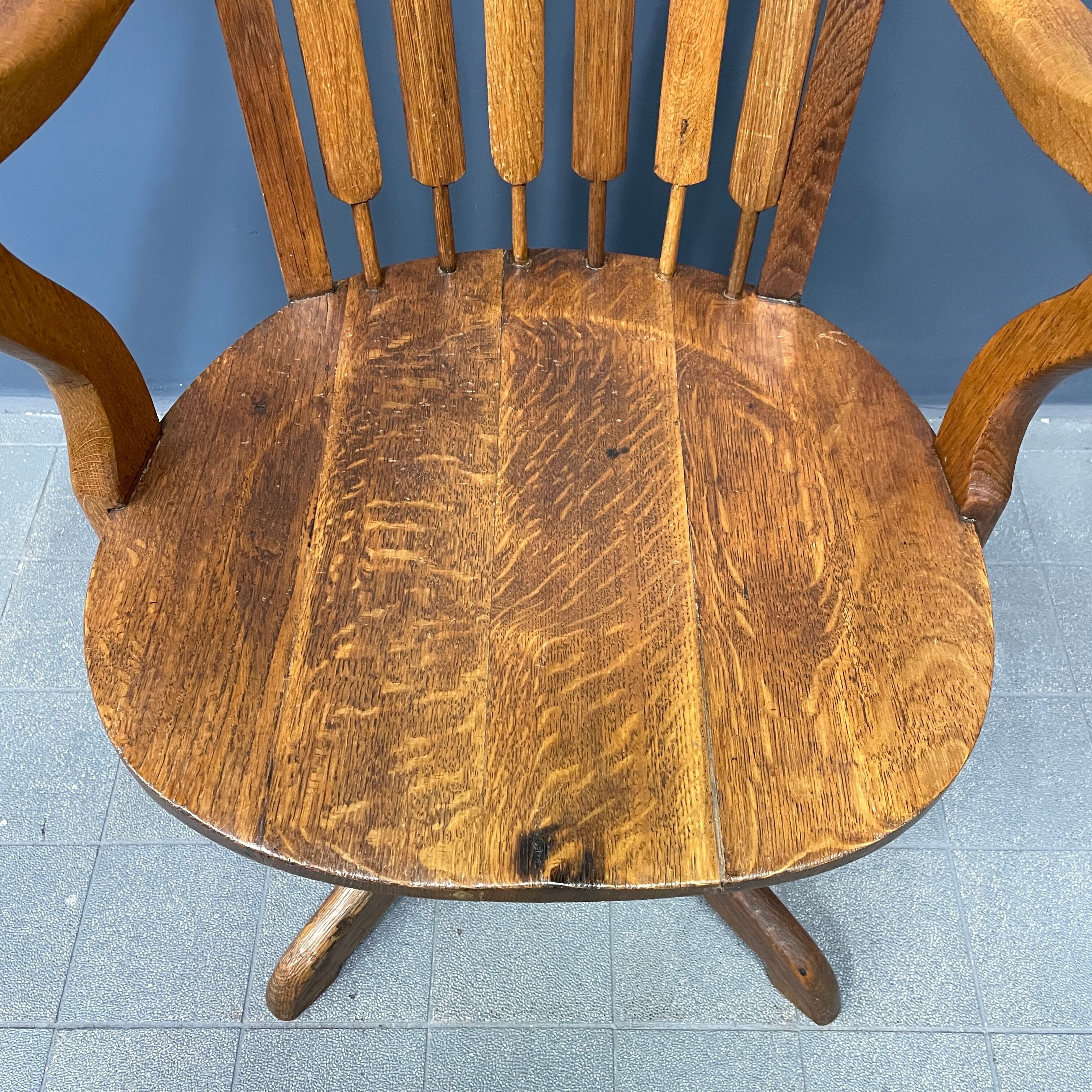 Antique American oak office chair with armrests 1920s