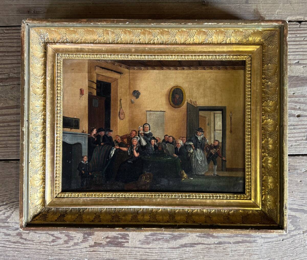 Pair of paintings, animated family scenes, oils on canvas, early 19th century