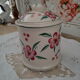 Vintage beige ceramic lid jar decorating pink flowers