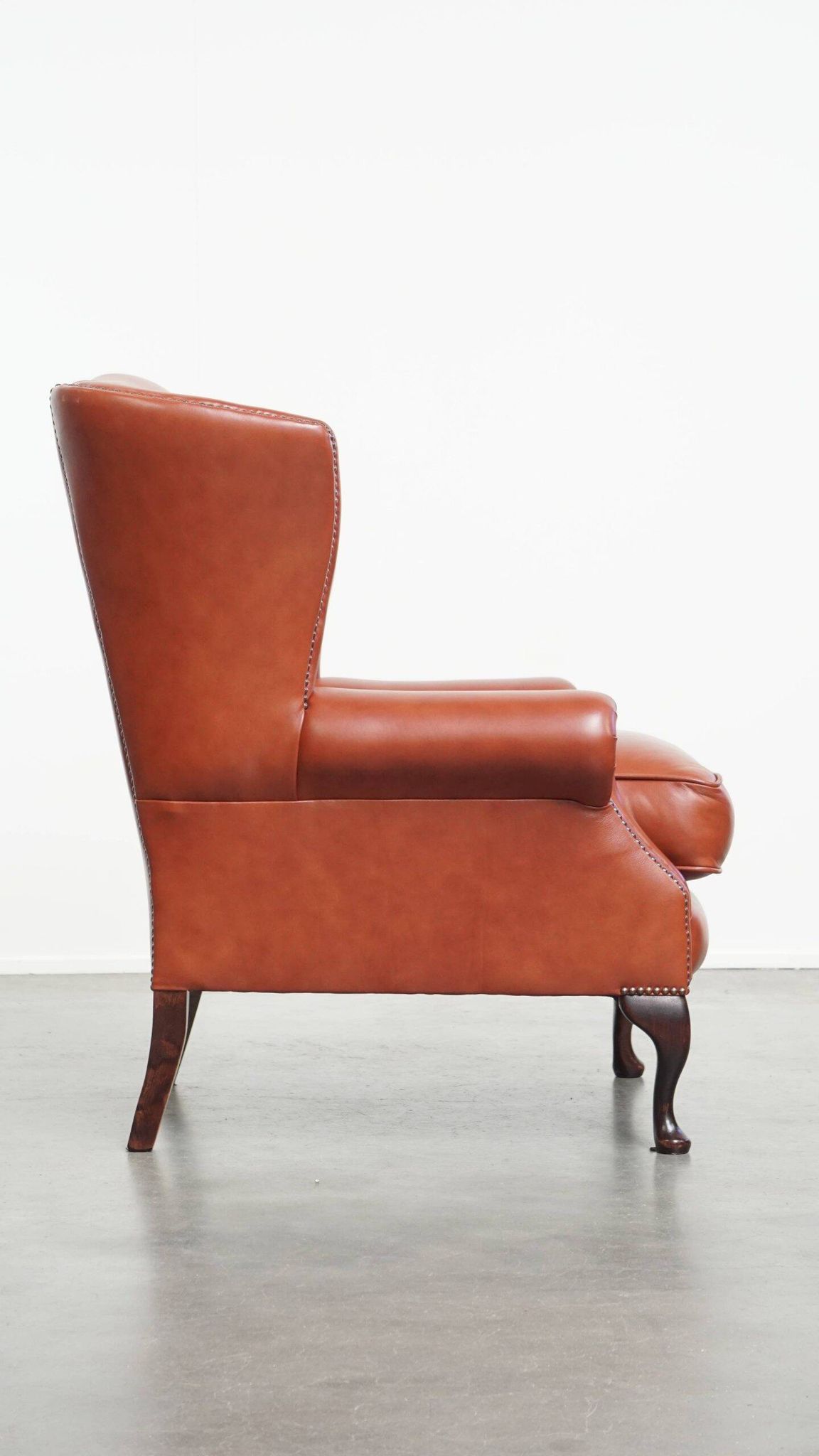 Elegant smooth English cowhide leather Chesterfield wingback armchair