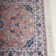 Saroukh design rug in fringed wool with a pink background 90x166cm