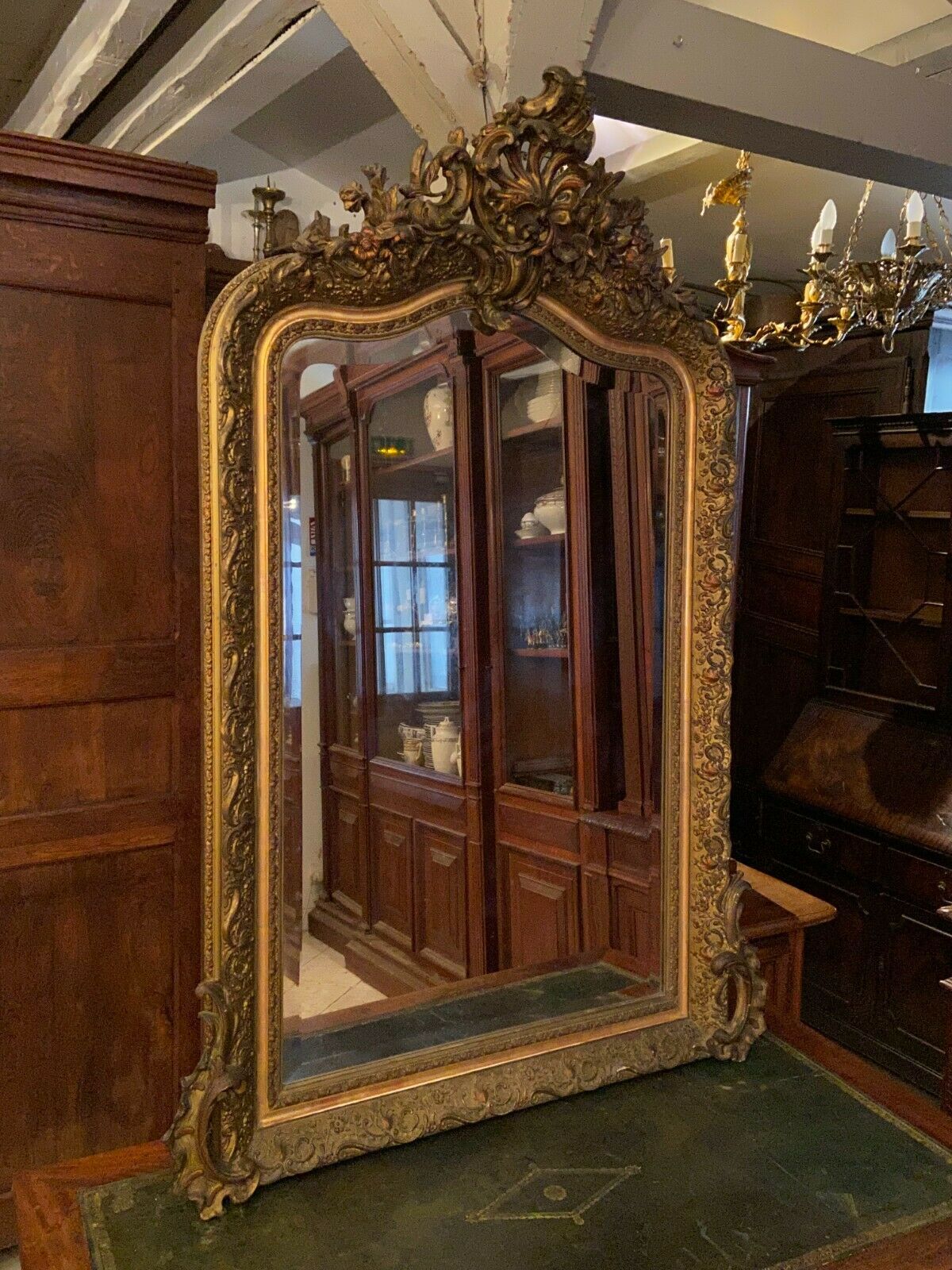 Golden mirror with bevelled ice pediment in Regency style