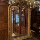 Golden mirror with bevelled ice pediment in Regency style