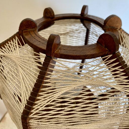 Wooden lamp and stretched wires