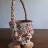Kitch pot cover in the shape of a shell decore basket