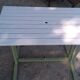 Old garden table with iron slats