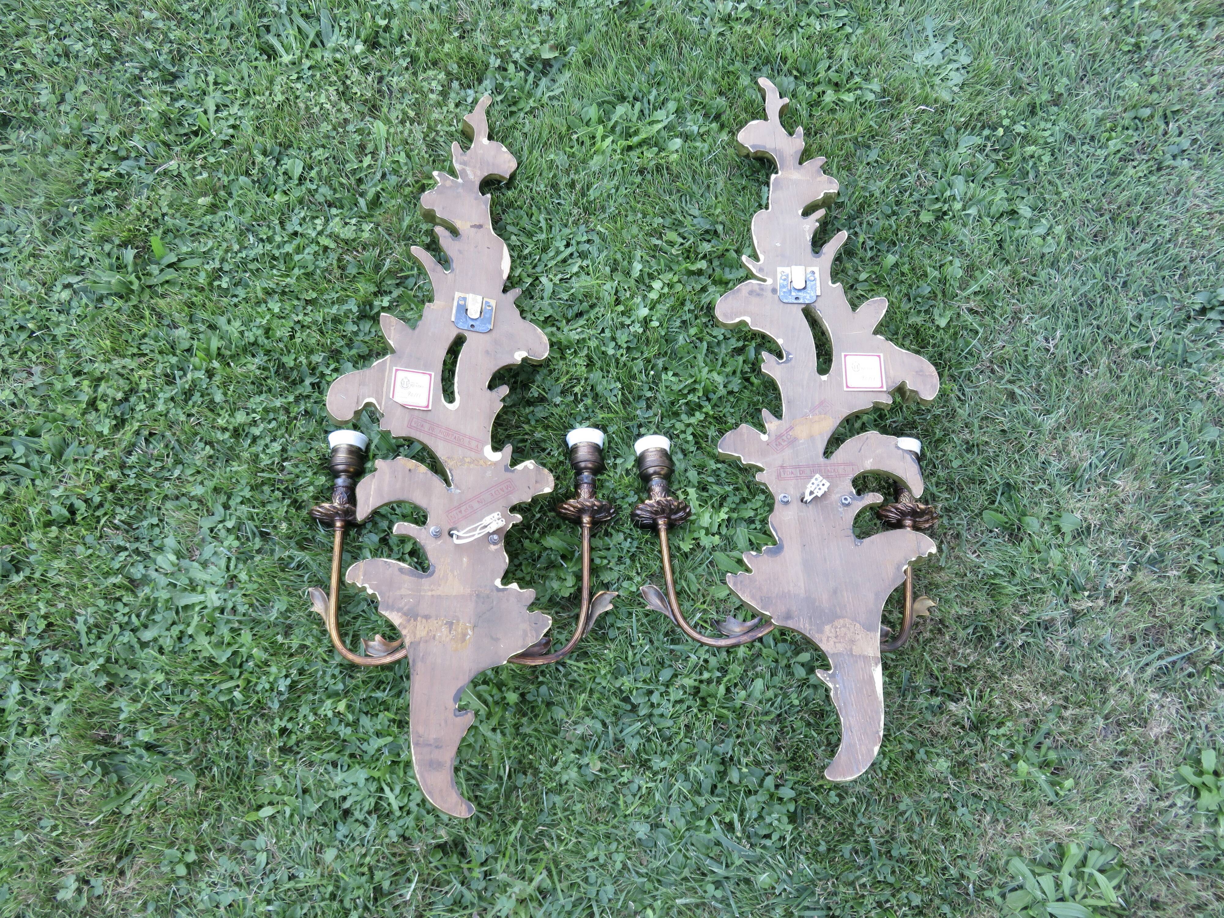 Pair of 86cm castle sconces in gilded wood from the 1940s