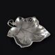 Leaf-shaped pocket tray in minimalist silver plating.