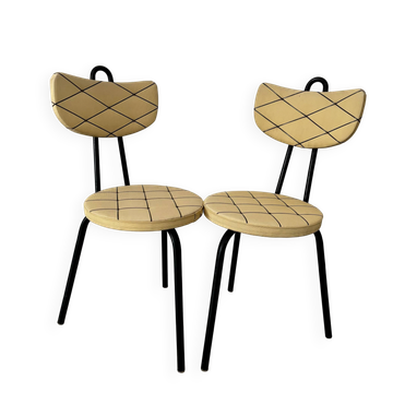 Pair of vintage retro mustard yellow chairs with black metal.