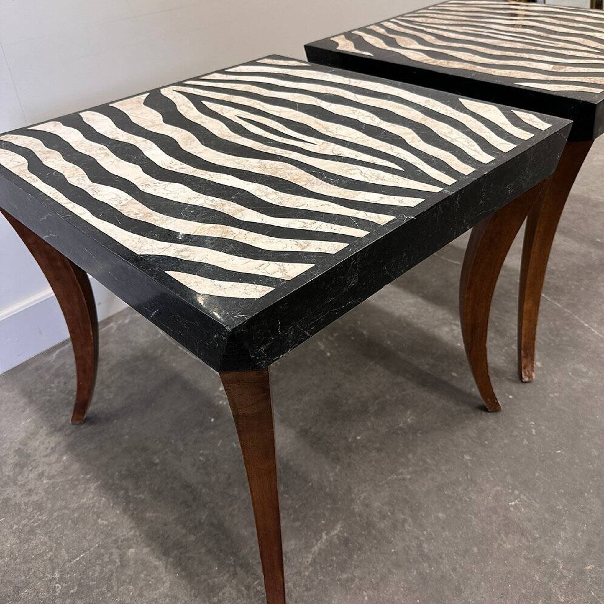Striking pair of Italian zebra inlaid tessellated stone tables with refined curves
