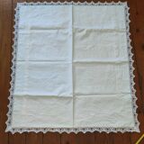 Ancient monogrammed pillowcase adorned with cotton lace