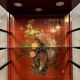 20th century China: Pretty bookcase in lacquer, hard stone and mother-of-pearl with three glazed sides