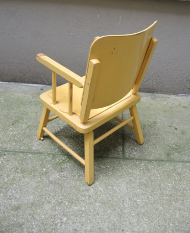 Children's chair in yellow wood