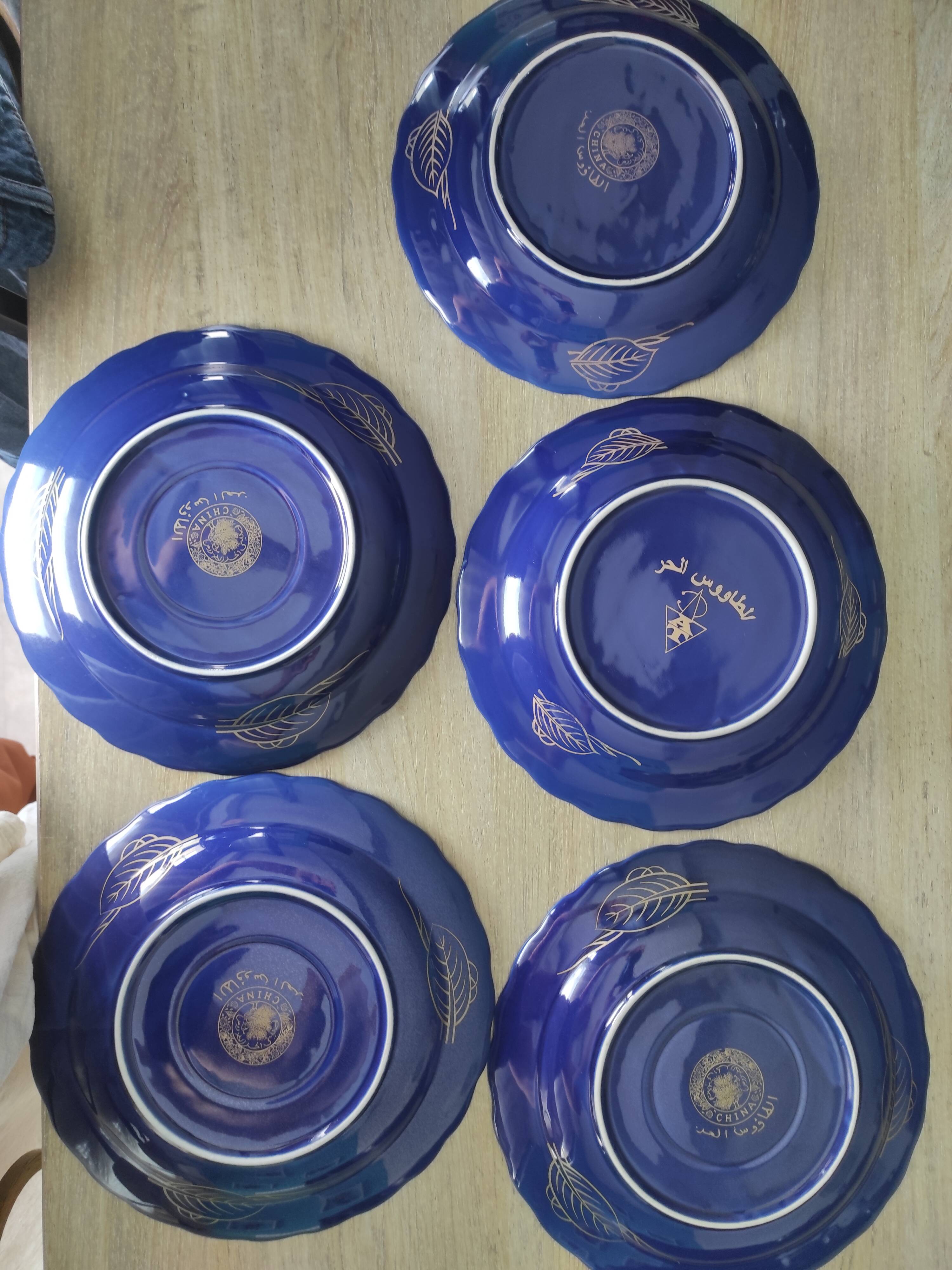 Vintage blue Taous dinnerware set of 21 pieces in very good overall condition.