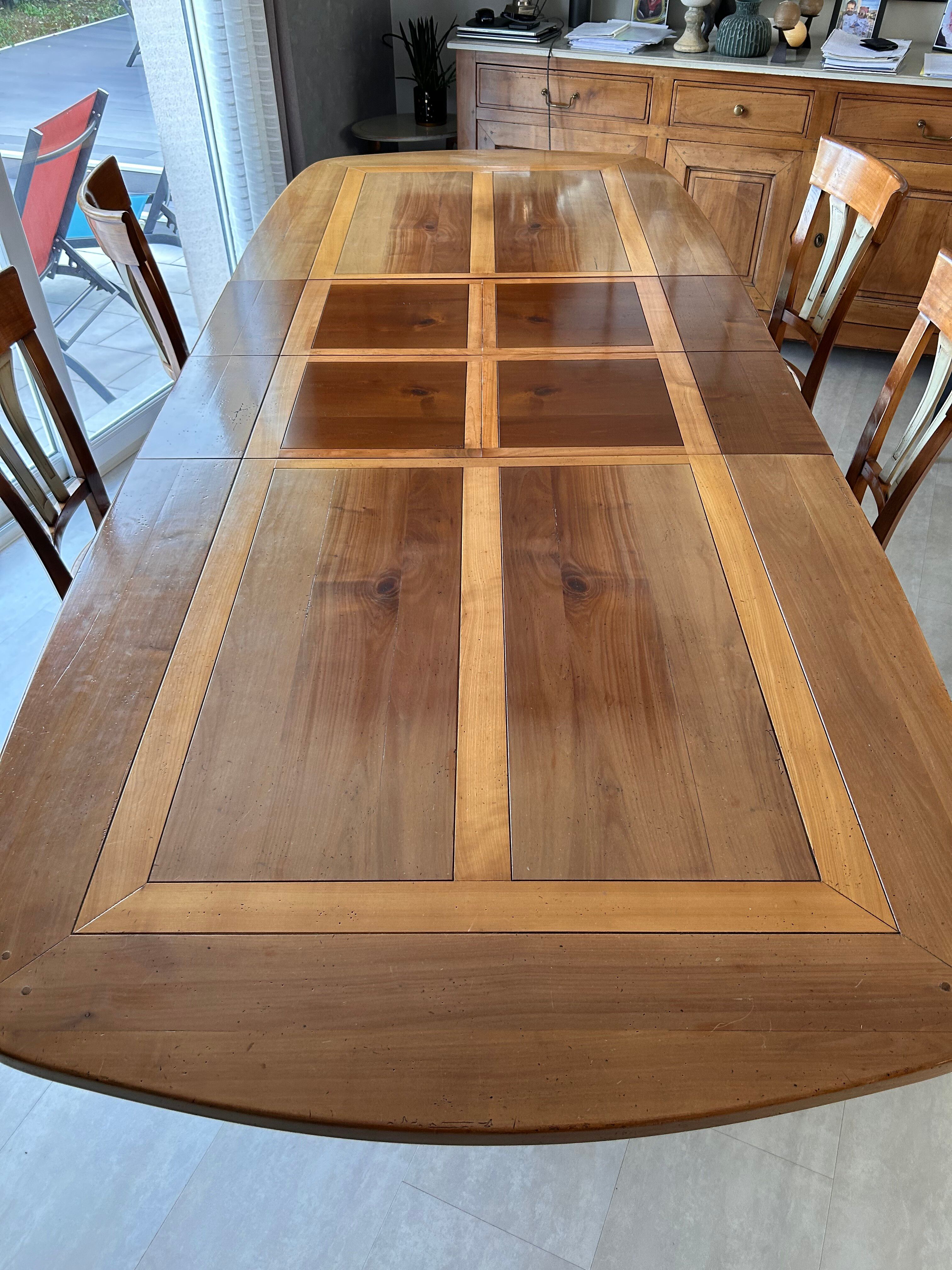 Extendable table in cherry wood with wrought iron legs.