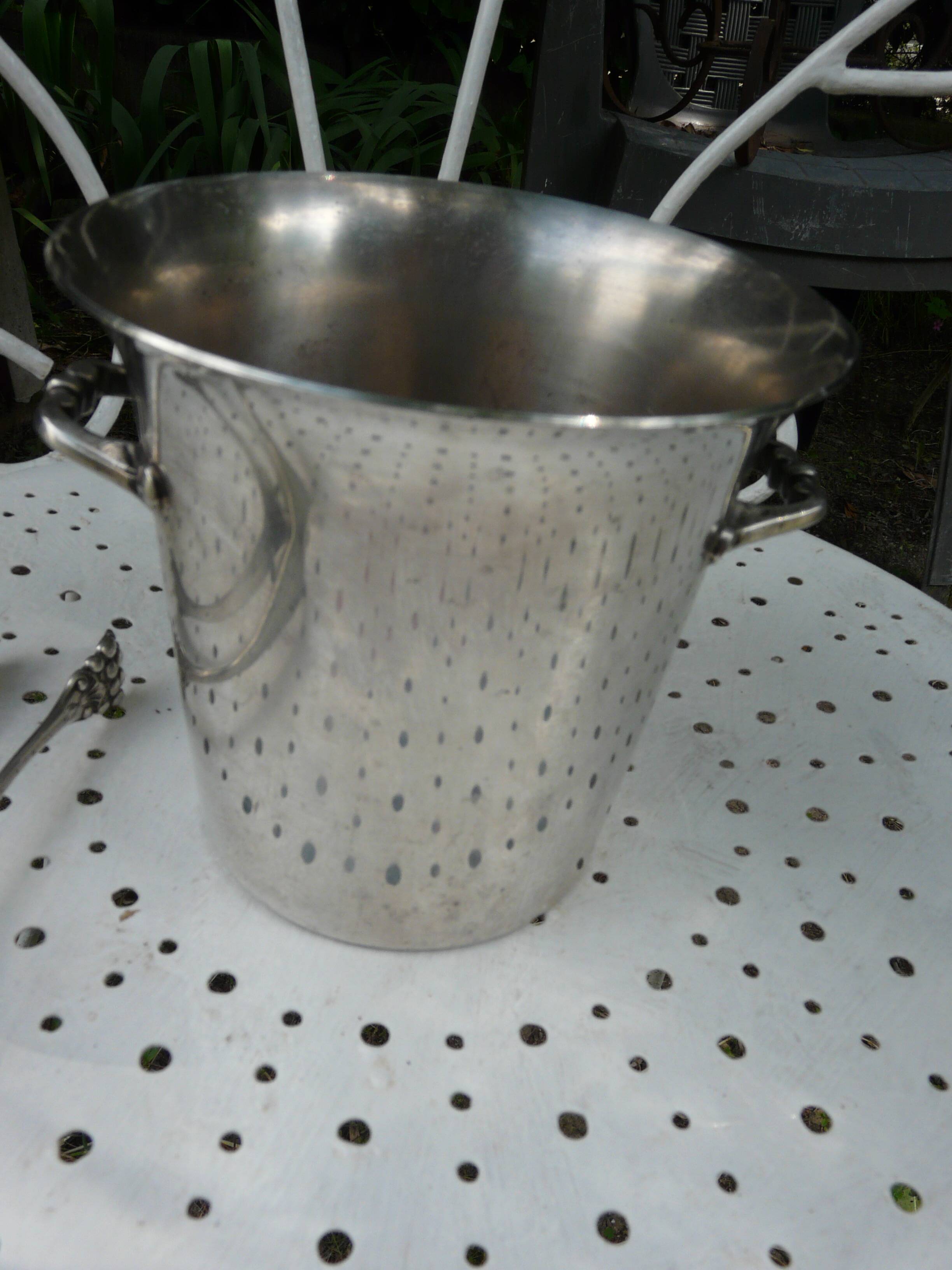 Silver metal ice bucket with its lion's pate tongs