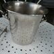 Silver metal ice bucket with its lion's pate tongs