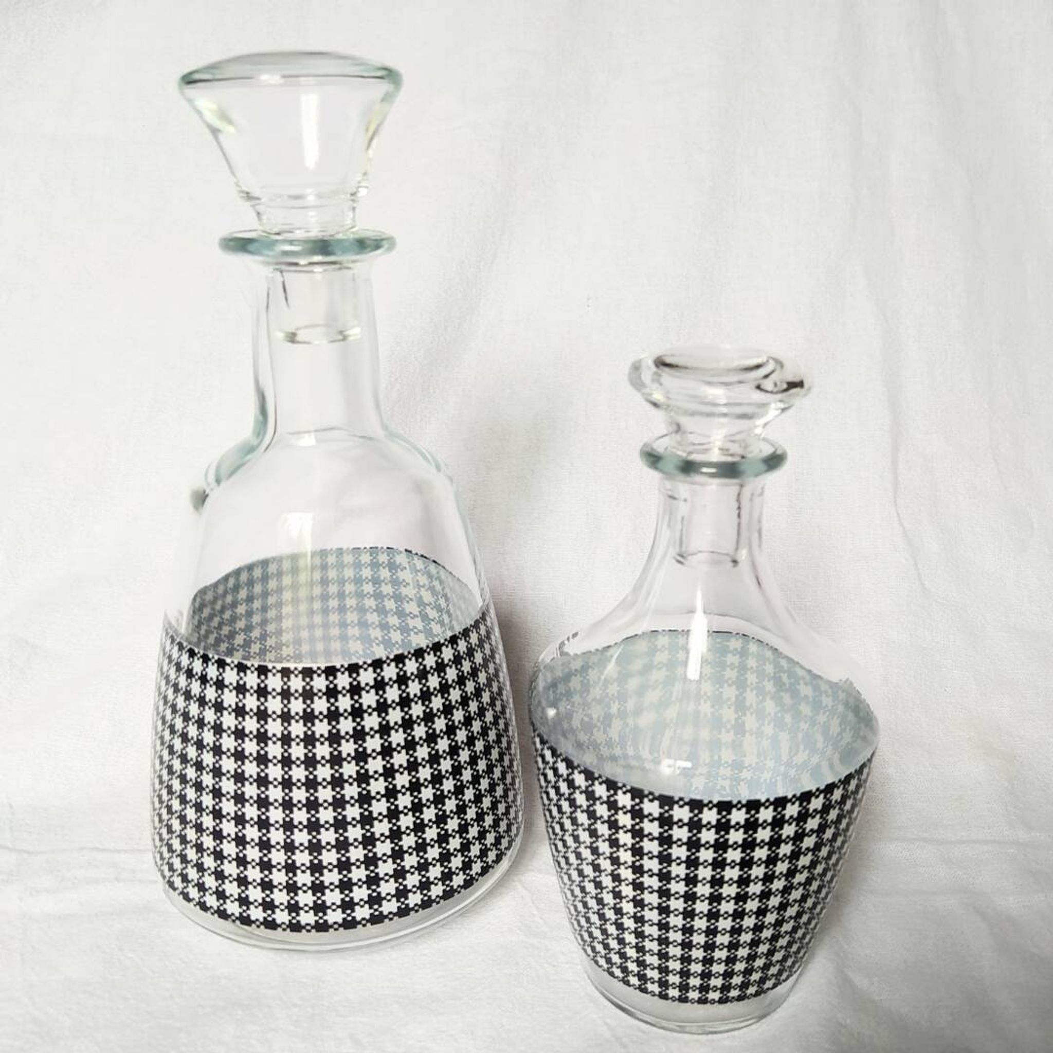 Set of 2 black and white houndstooth glass carafes from the Arques crystal factory. Rare.