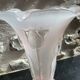 Pink glass vase decorated with tulips
