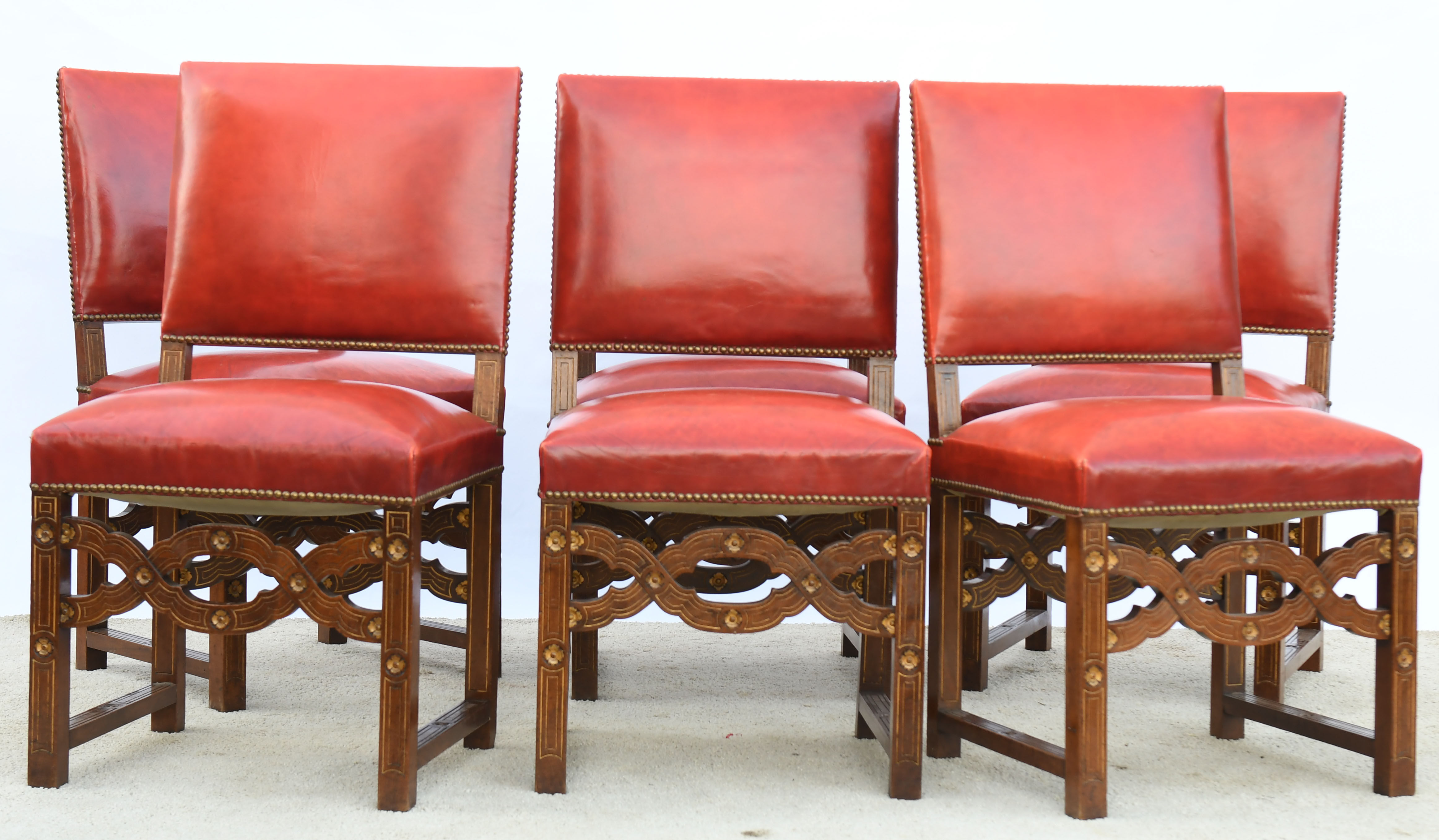 6 red leather chairs