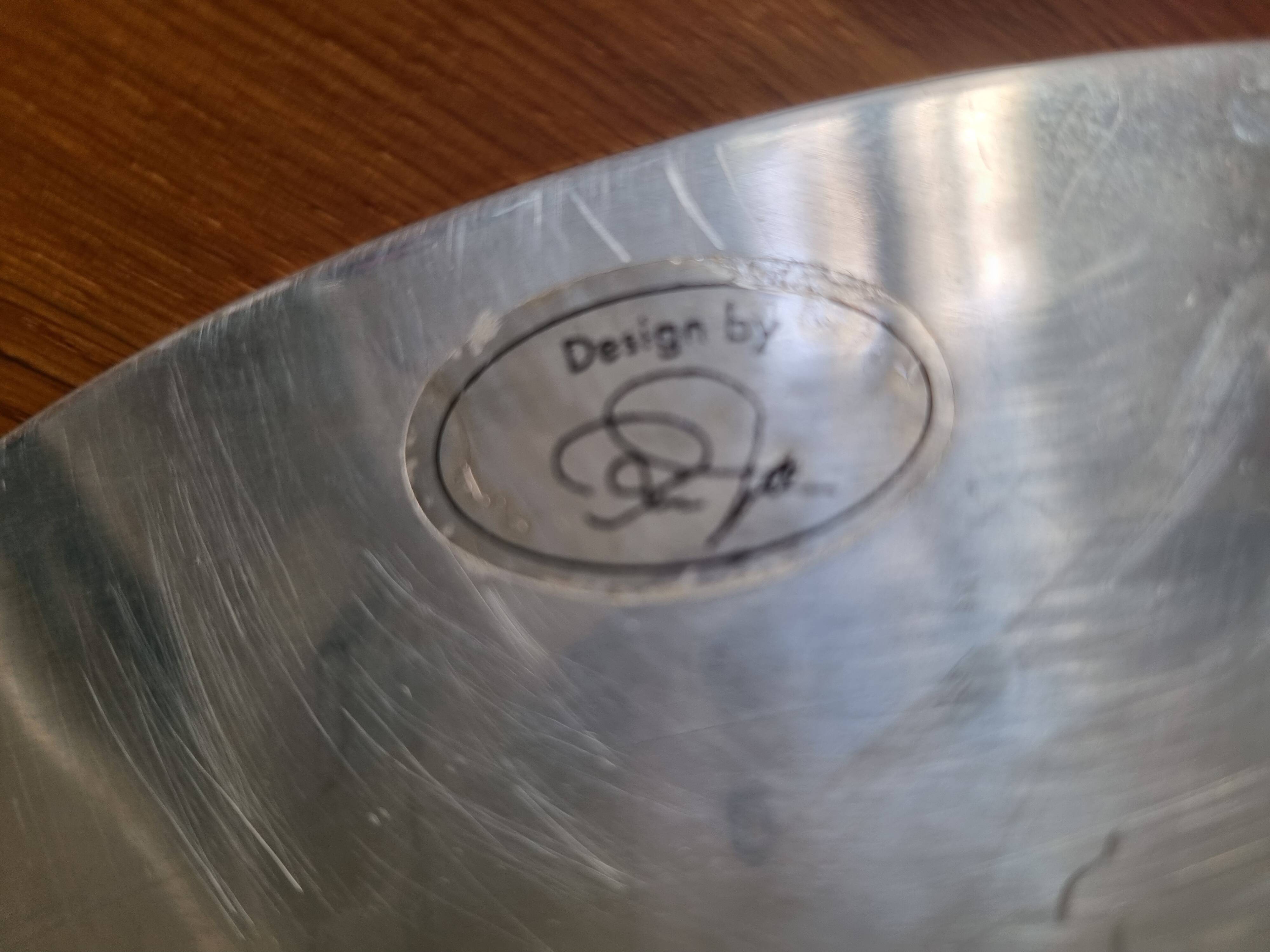 Large round hollow metal dish