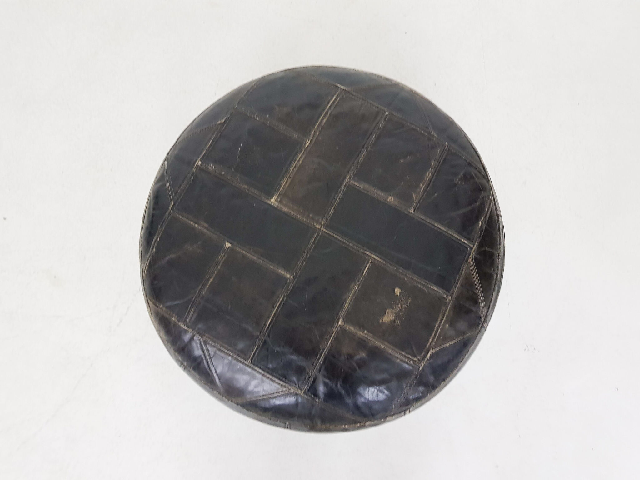 Mid-century round leather ottoman