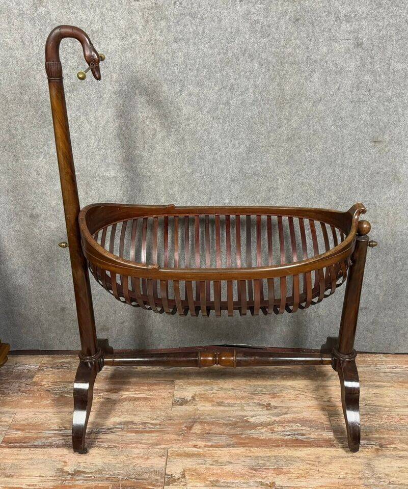 Empire style mahogany cradle with a swan neck, shaped like a cradle, circa 1810