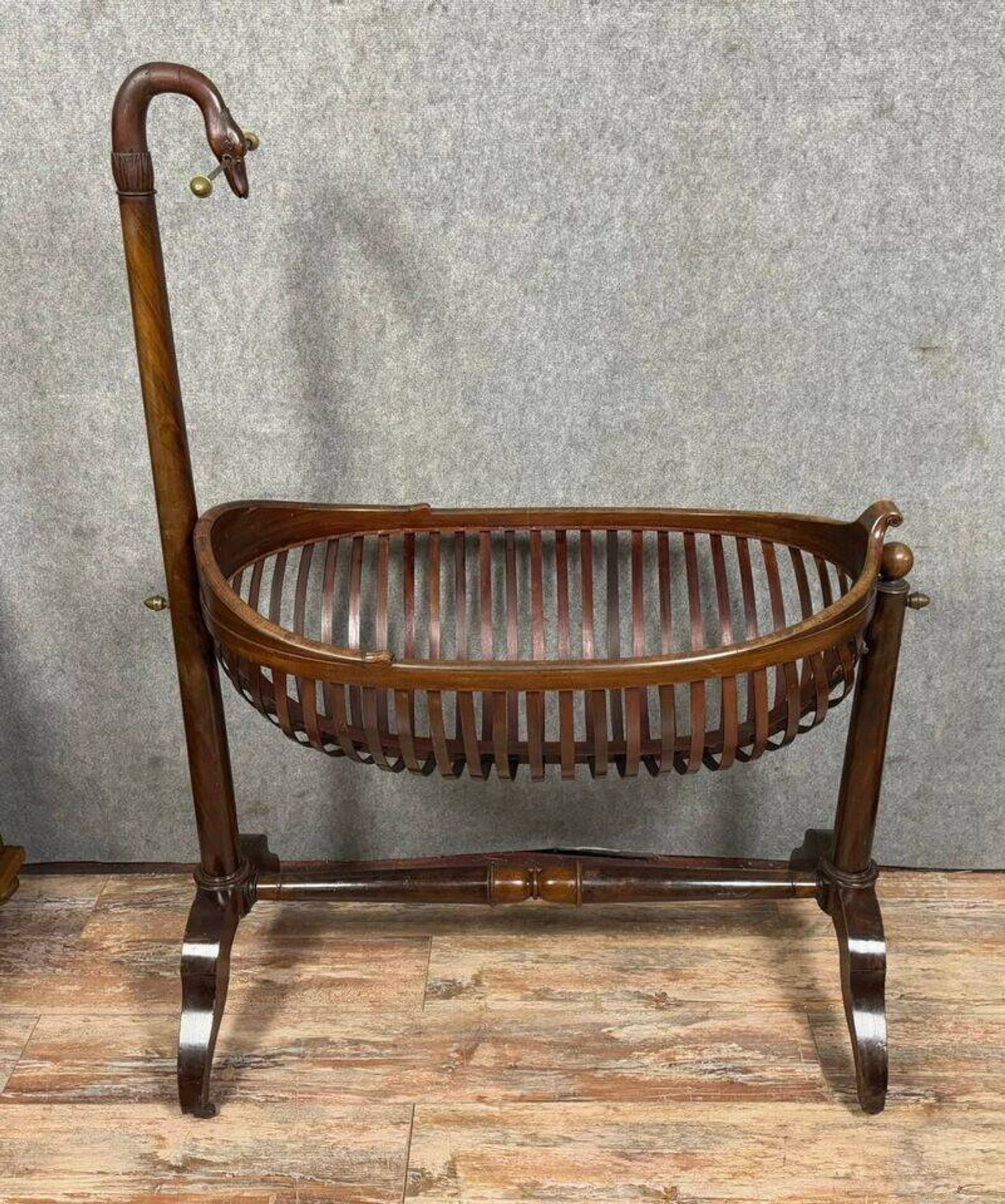 Empire style mahogany cradle with a swan neck, shaped like a cradle, circa 1810