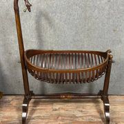 Empire style mahogany cradle with a swan neck, shaped like a cradle, circa 1810