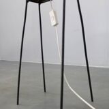 Mid-century modern floor lamp on iron legs with plastic shade and wood accent