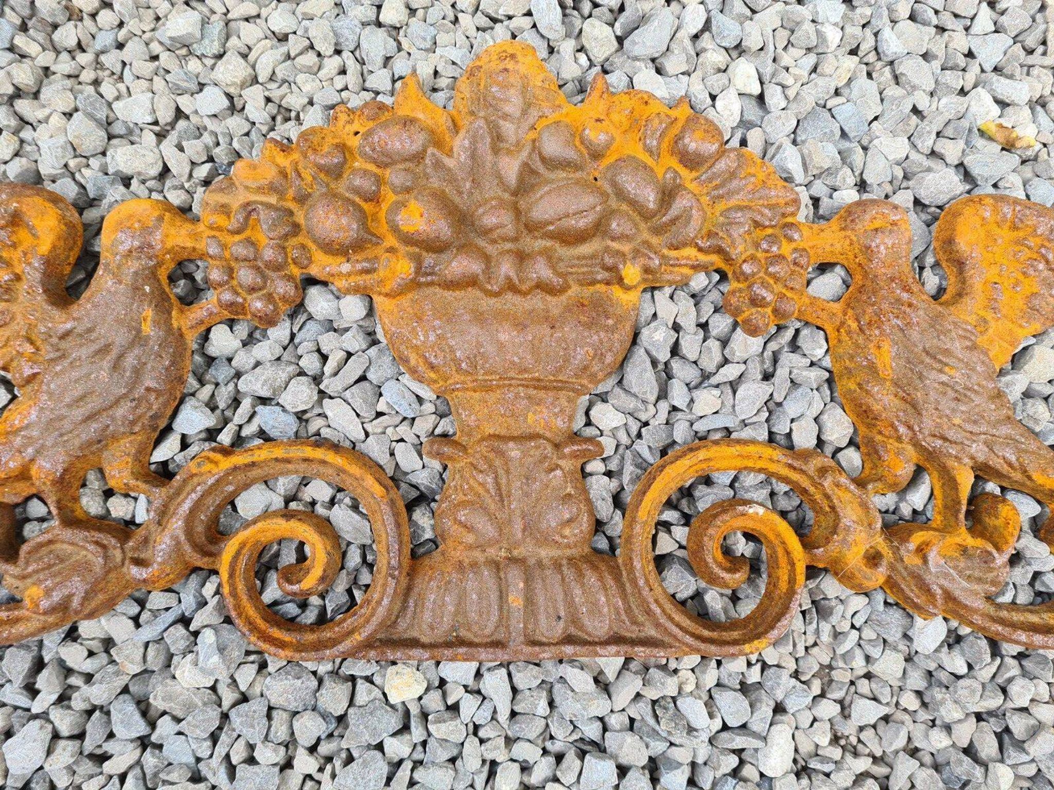 Cast iron pediment with birds