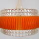 Transparent plastic space age lustre with orange band from the 70s.