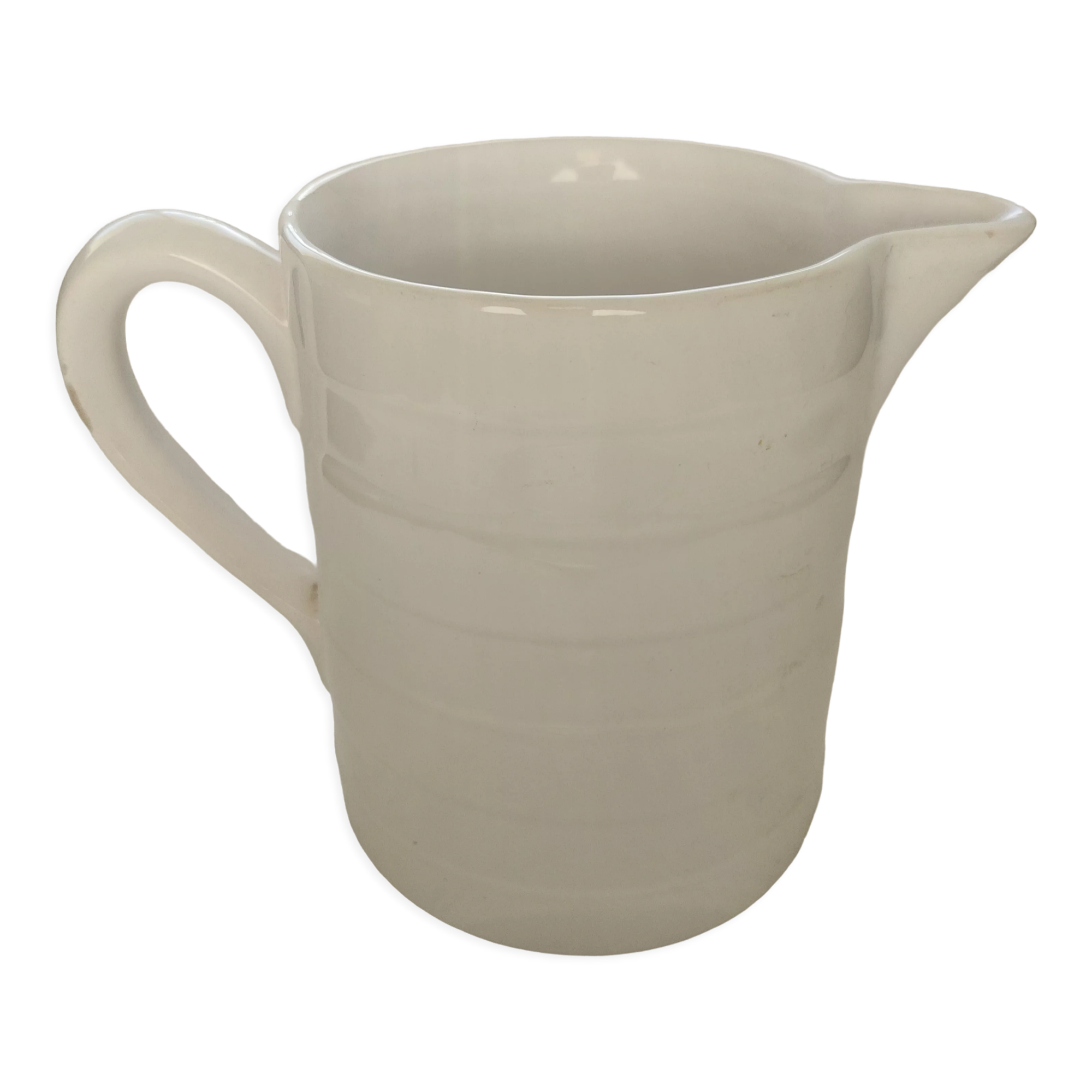 Antique white ceramic pitcher