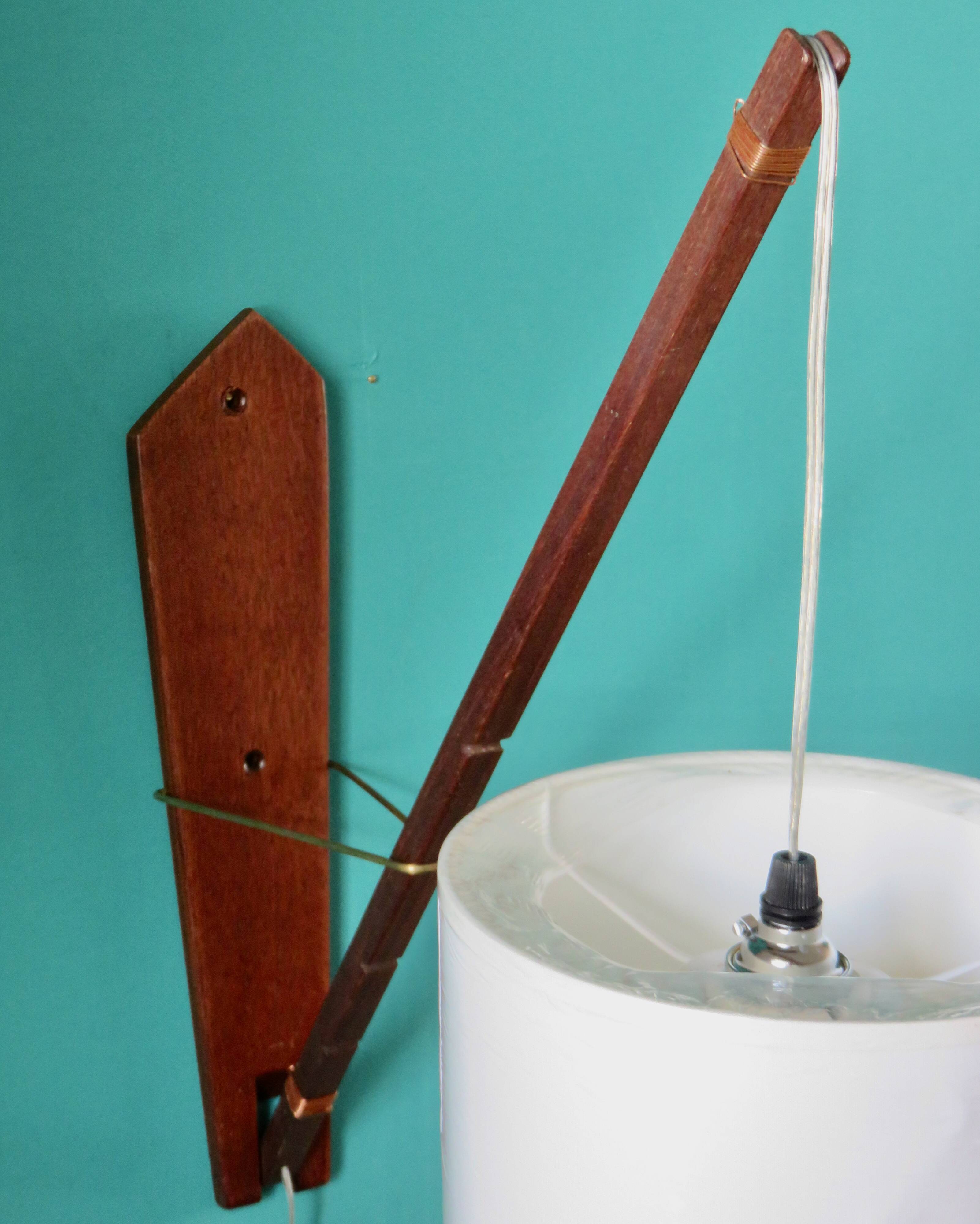 Teak wall light with articulated arm. Denmark 1960
