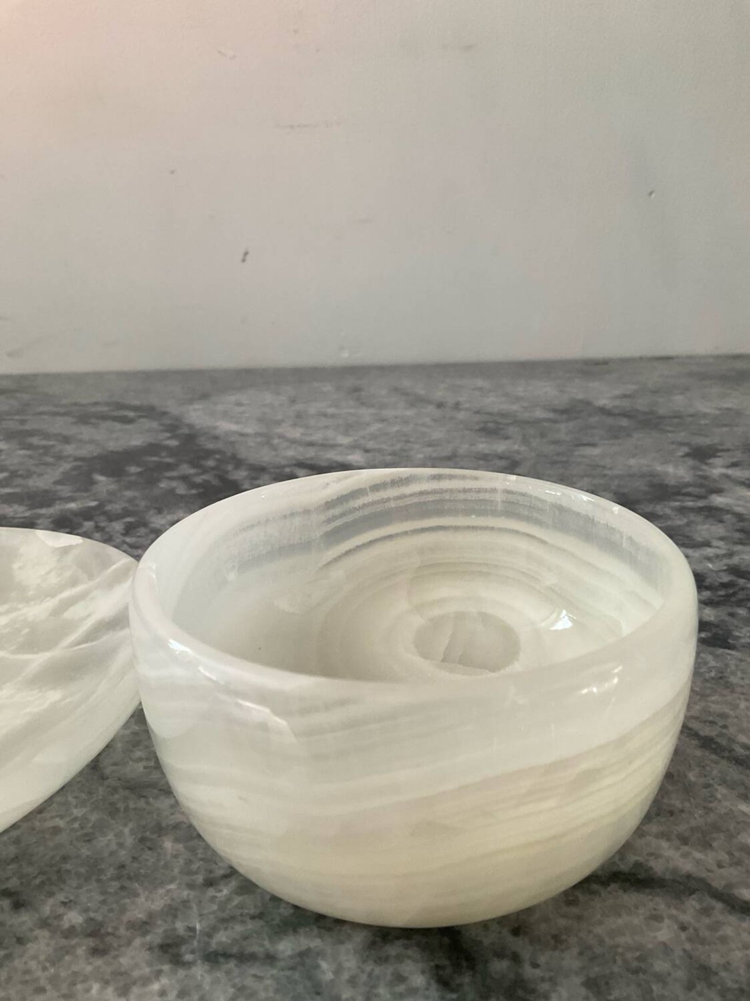 A pair of vintage onyx catchalls from the 1970s.