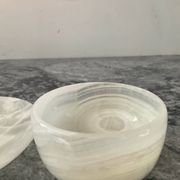 A pair of vintage onyx catchalls from the 1970s.