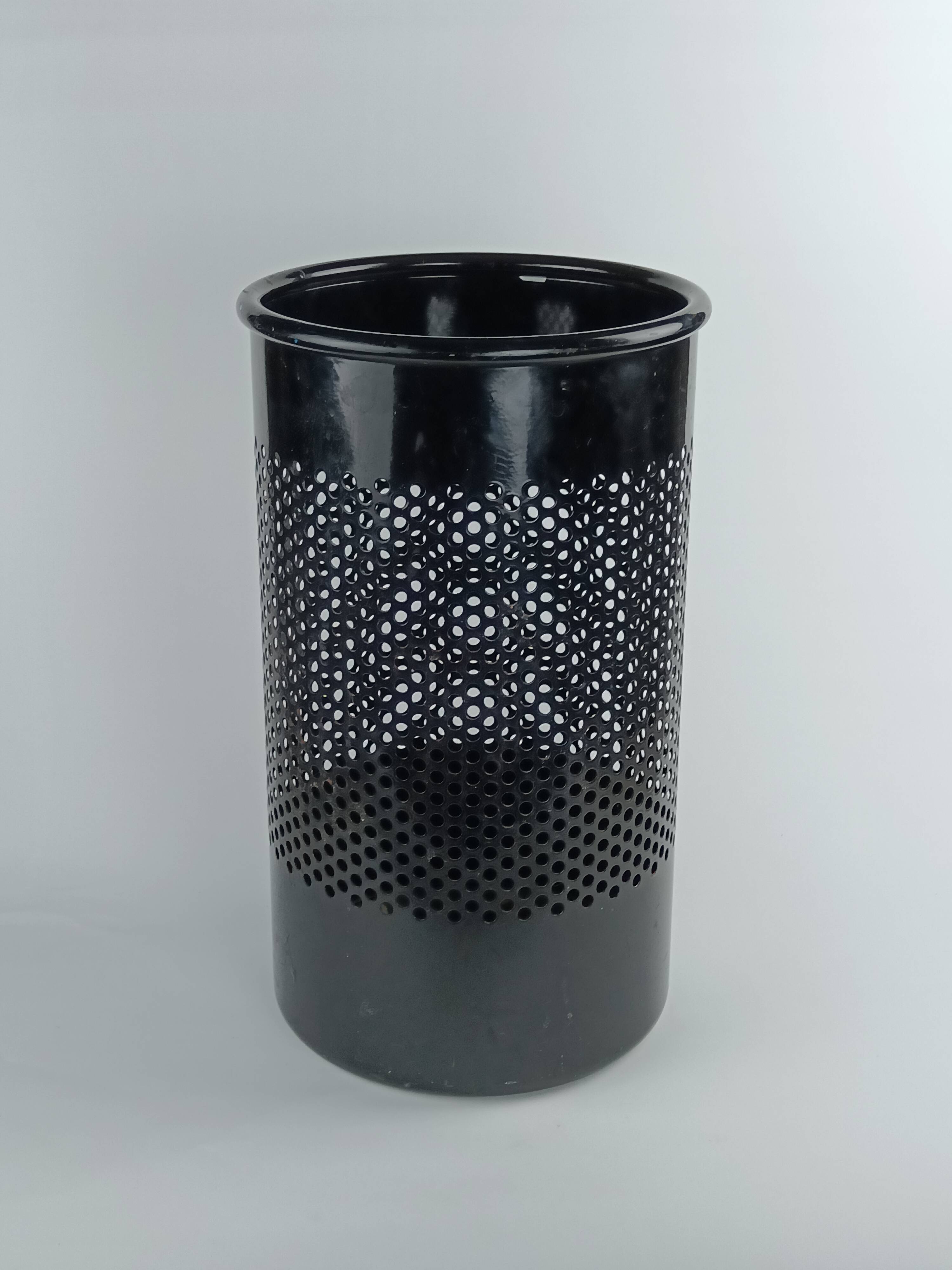 Perforated metal wastebasket