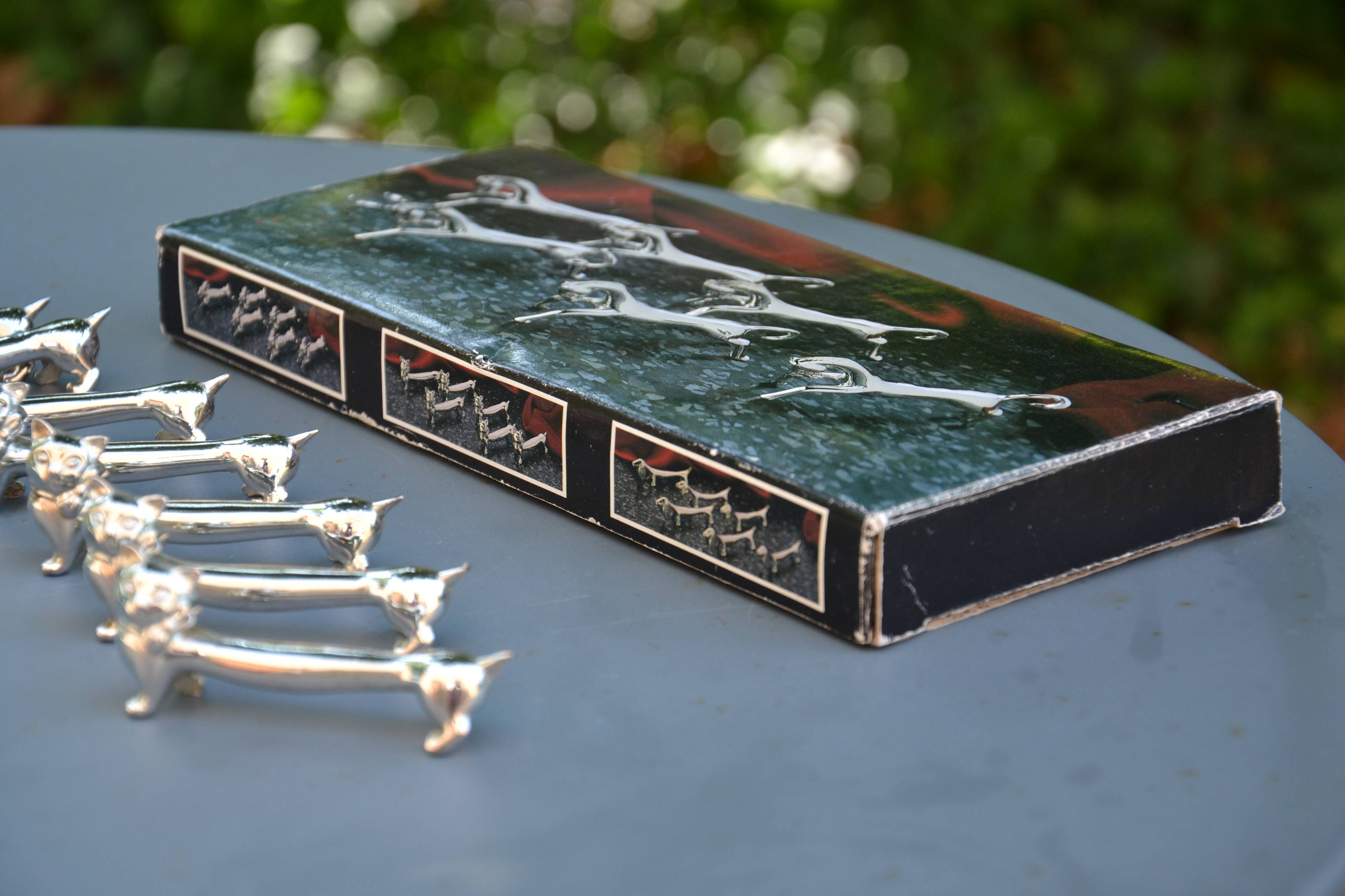 12 silver-plated cat knife rests