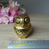 Old small black and gold lacquered wooden box in the shape of an owl