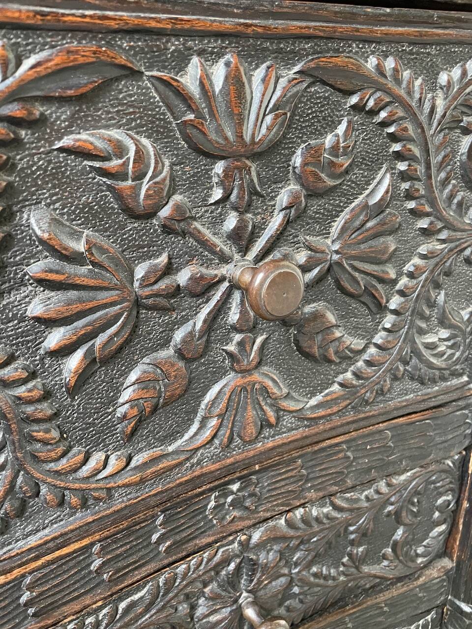 19th century chest of drawers in carved blackened pine