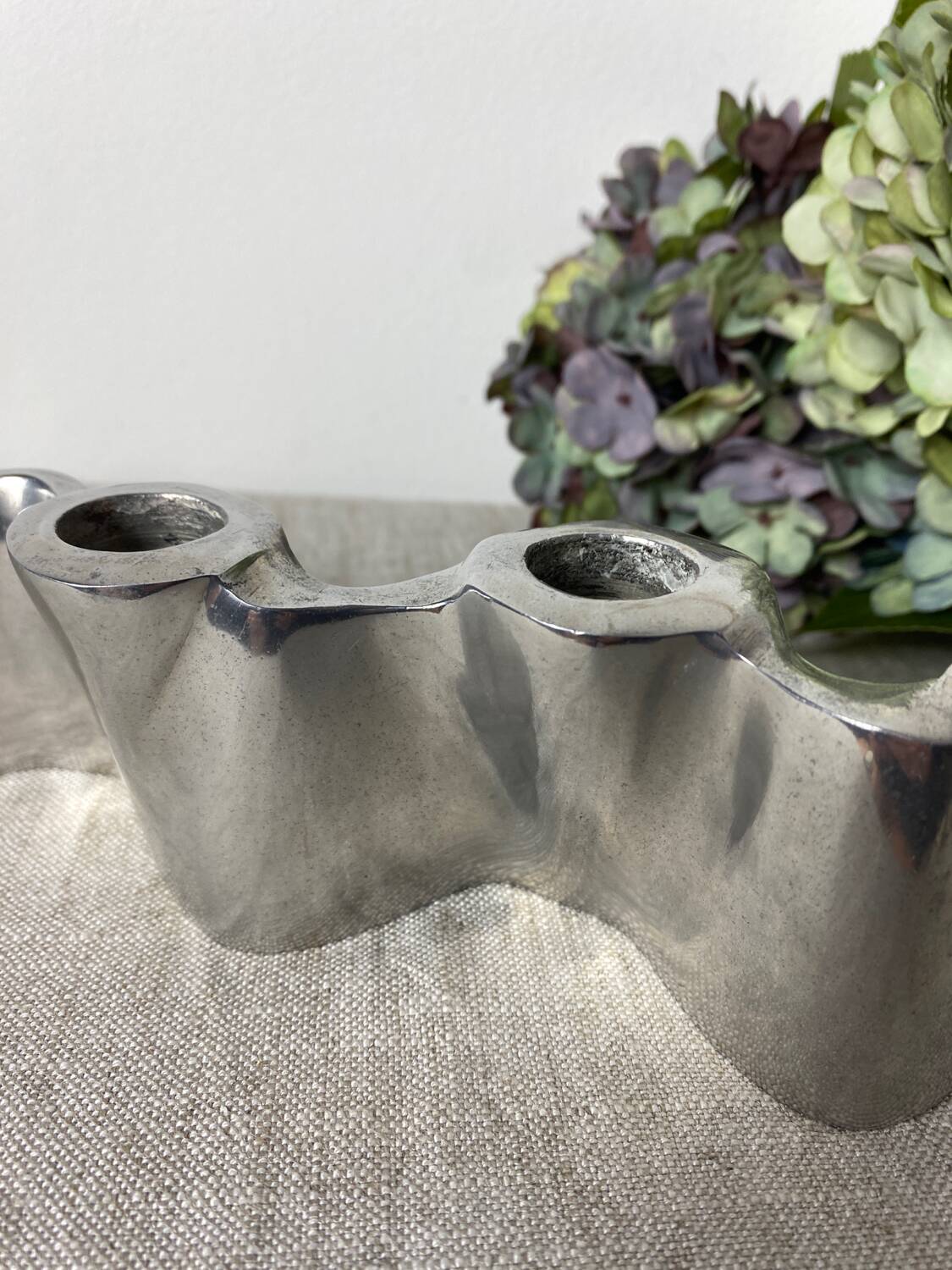 Brushed aluminum candle holder