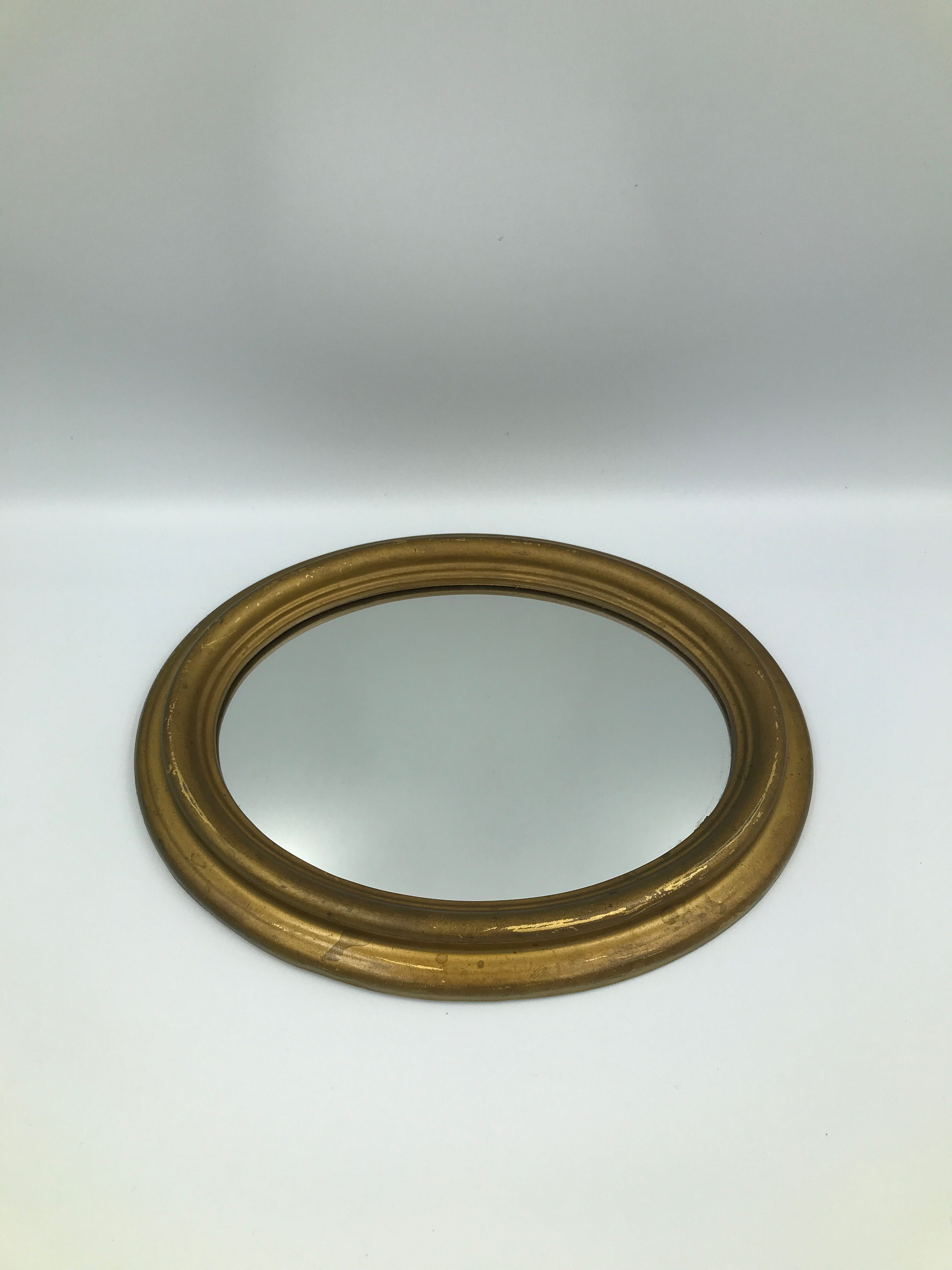 Vintage old bevelled oval mirror