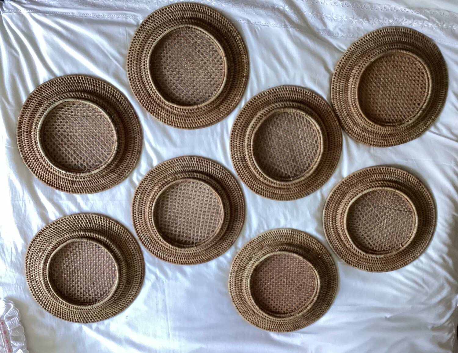 Set of round woven rattan and canework coasters