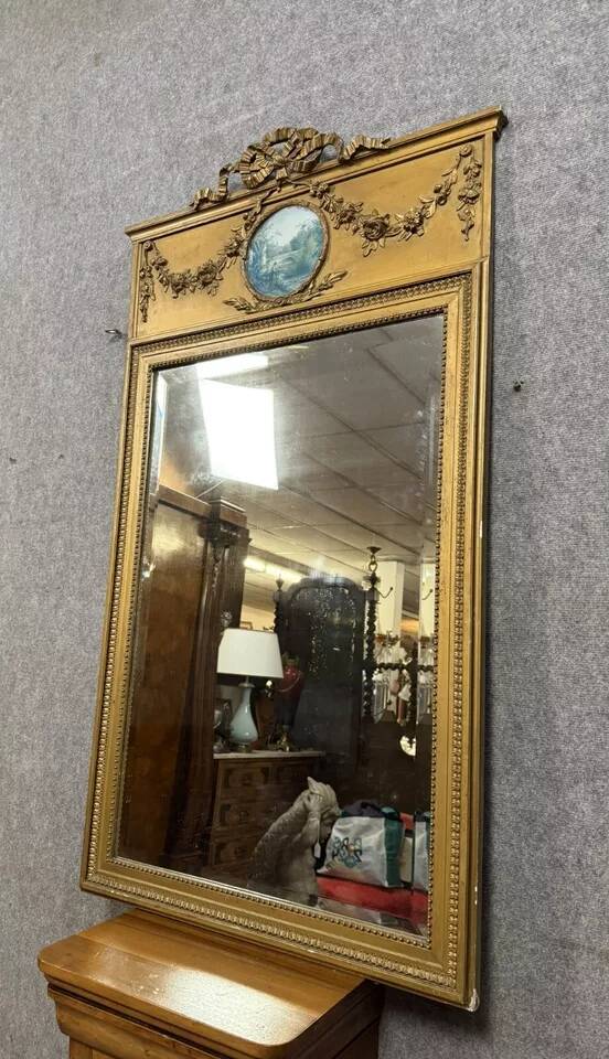 Louis XVI style trumeau mirror in gilded wood, circa 1900