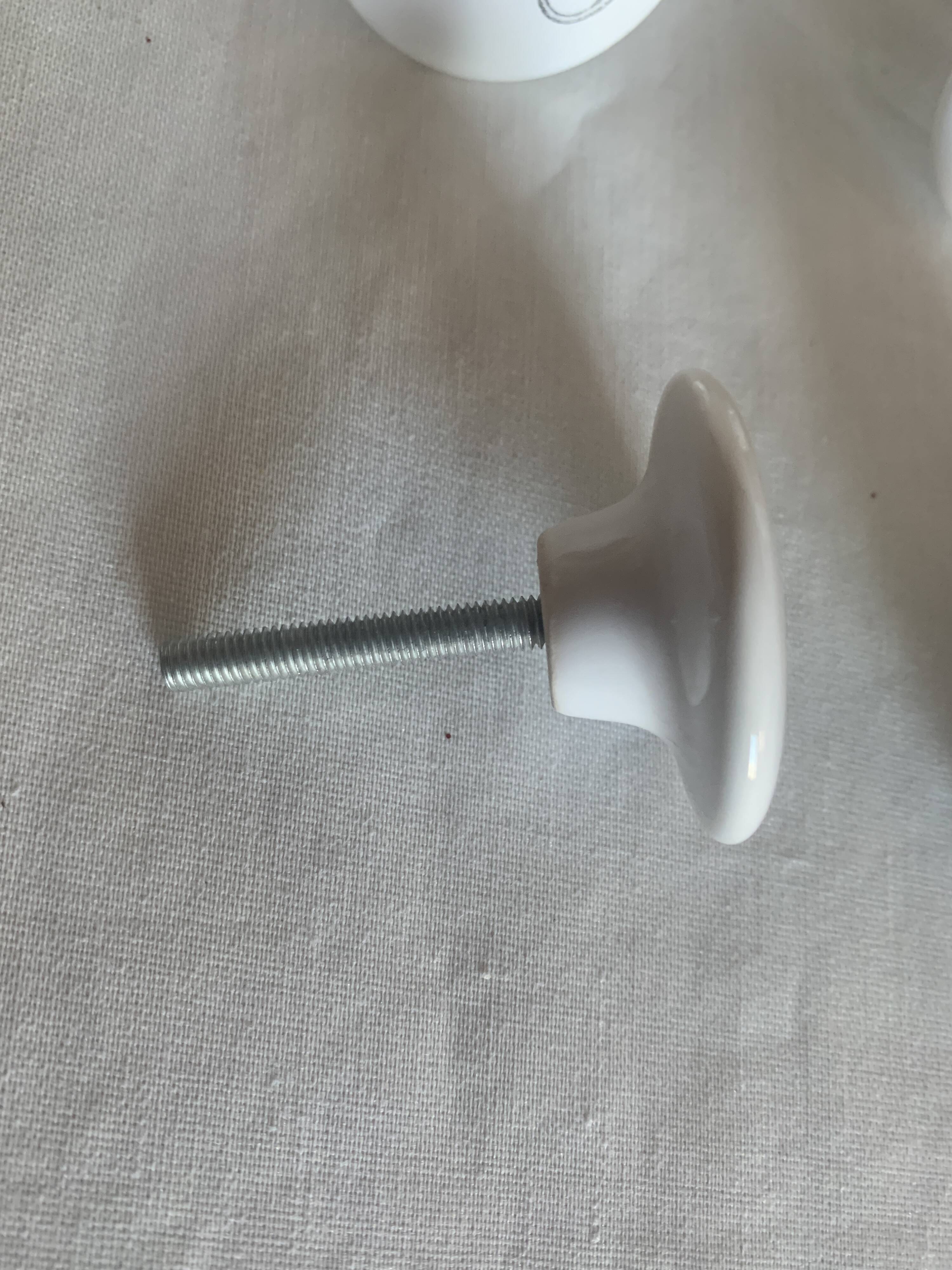 white ceramic door knobs with illustration