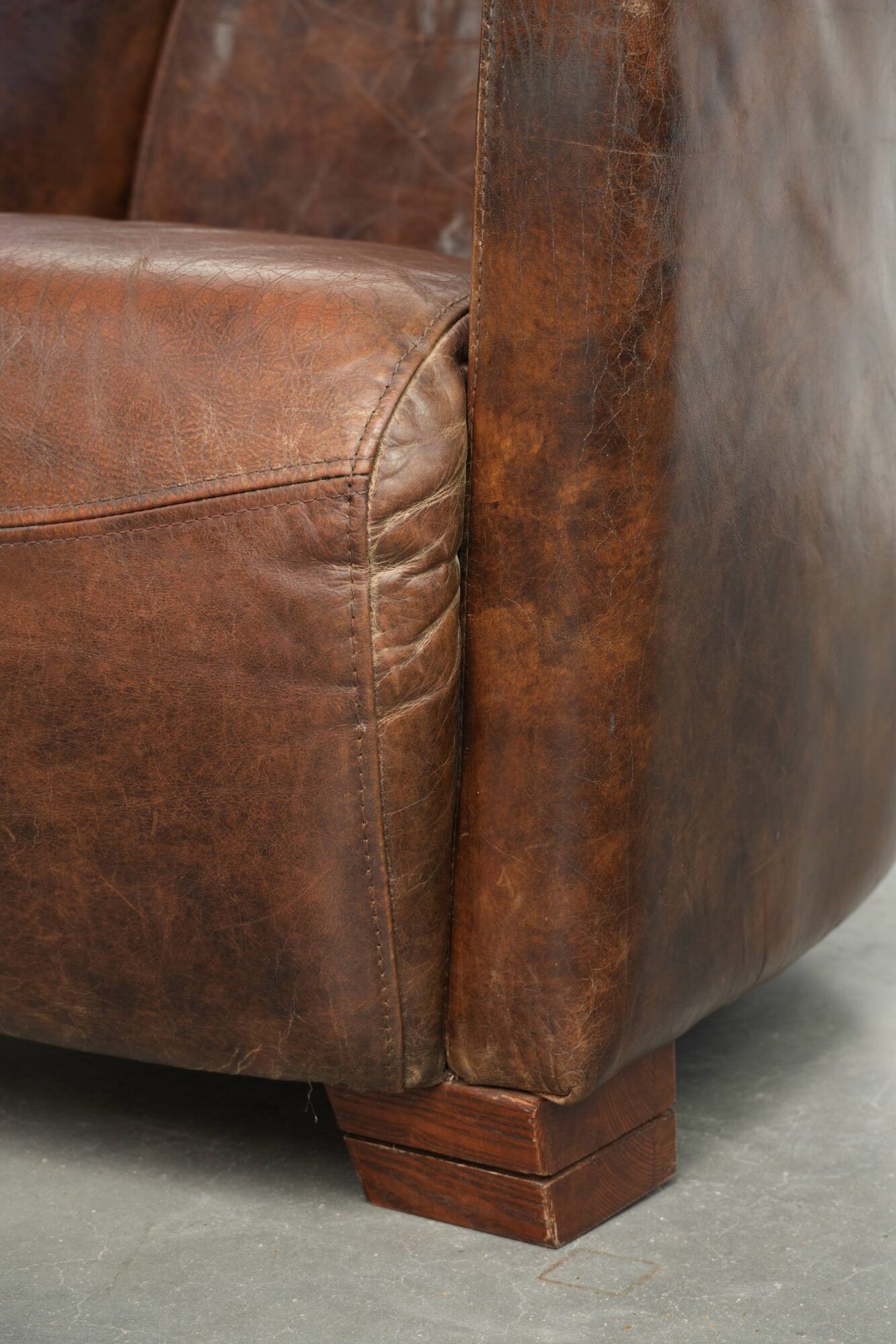 Cowhide armchair in Aviator design in a warm brown colour